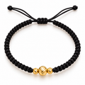 Black woven bracelet with gold beads – solid 18k gold