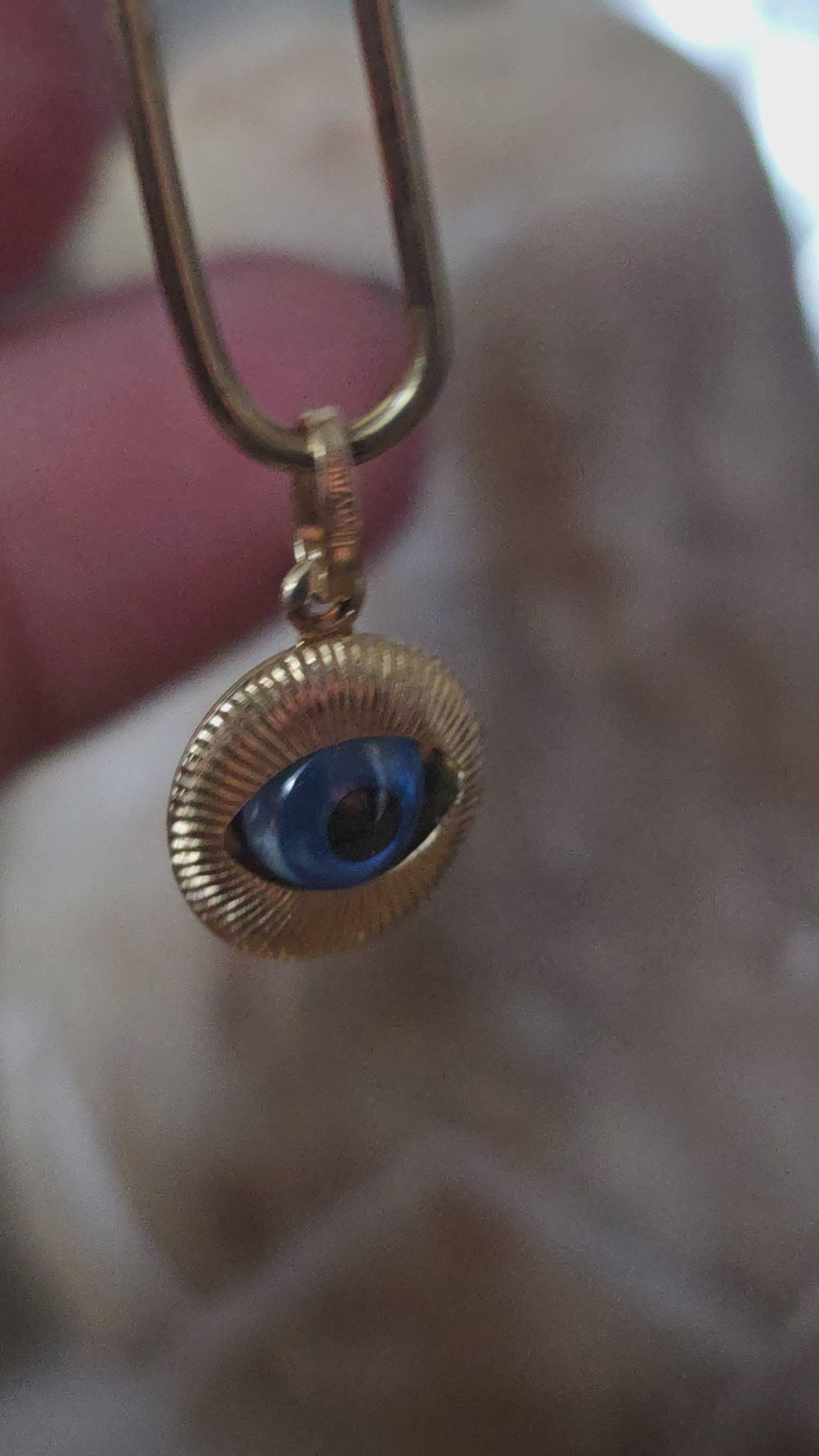Ojo de pavo colgante