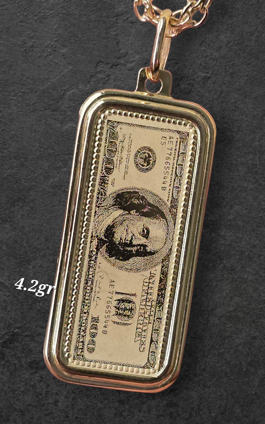 $100 USD bill pendant weighing 2.4 grams