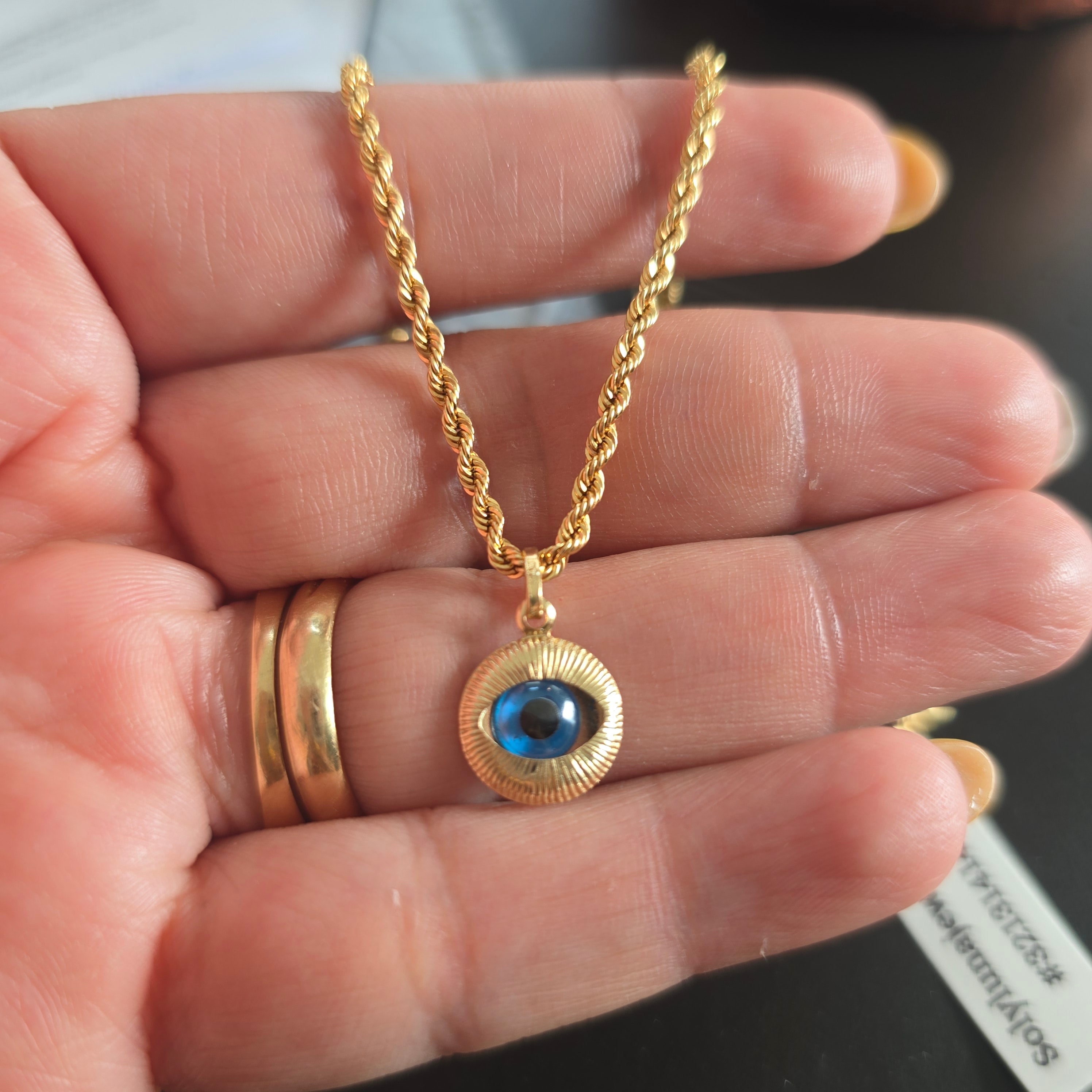 Turkish eye pendant, 1 gram, with 45 cm woven bow chain in 18-karat Italian yellow gold, 2.8 grams