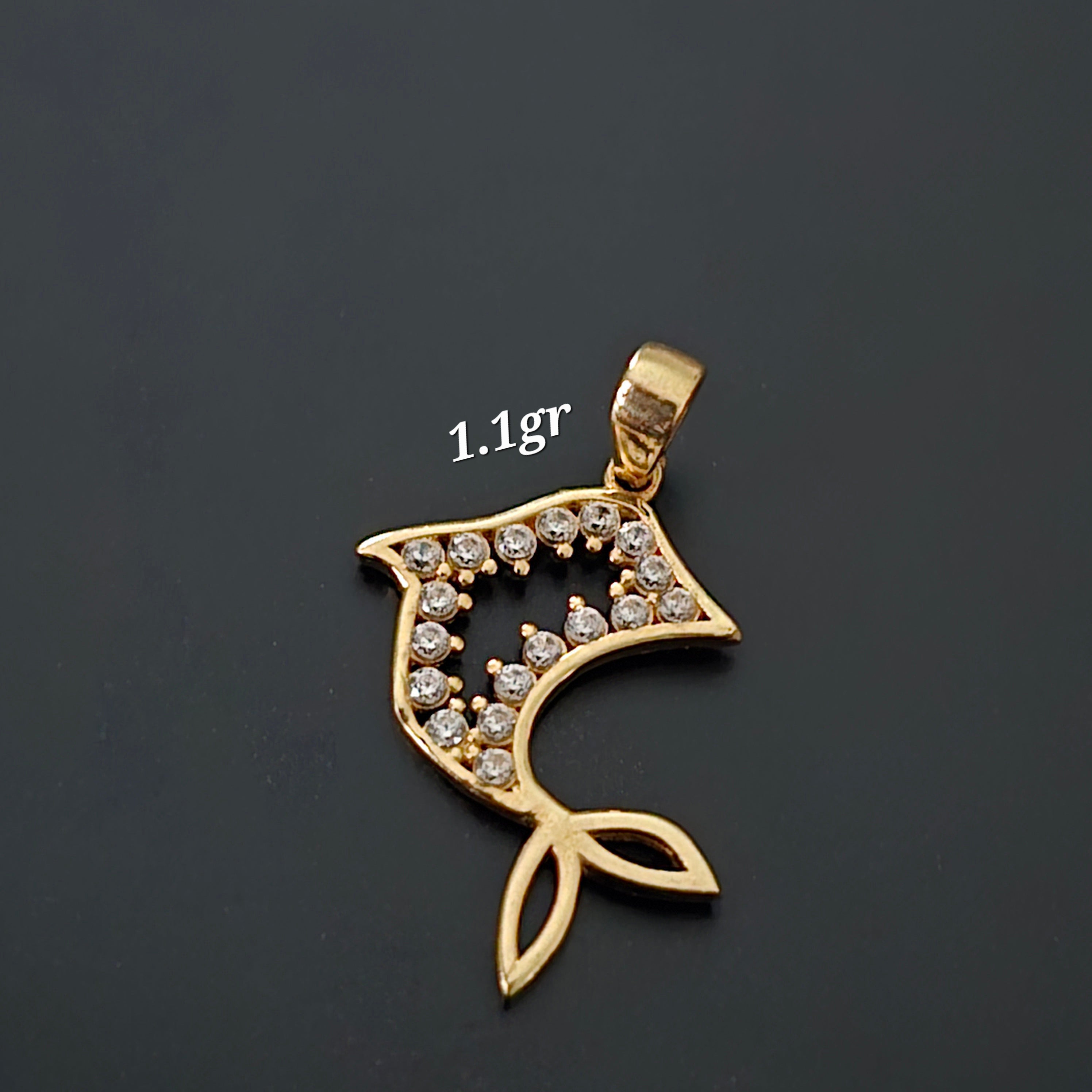 Dolphin silhouette pendant with white zircons in 18karat Italian yellow gold, 1.1 grams