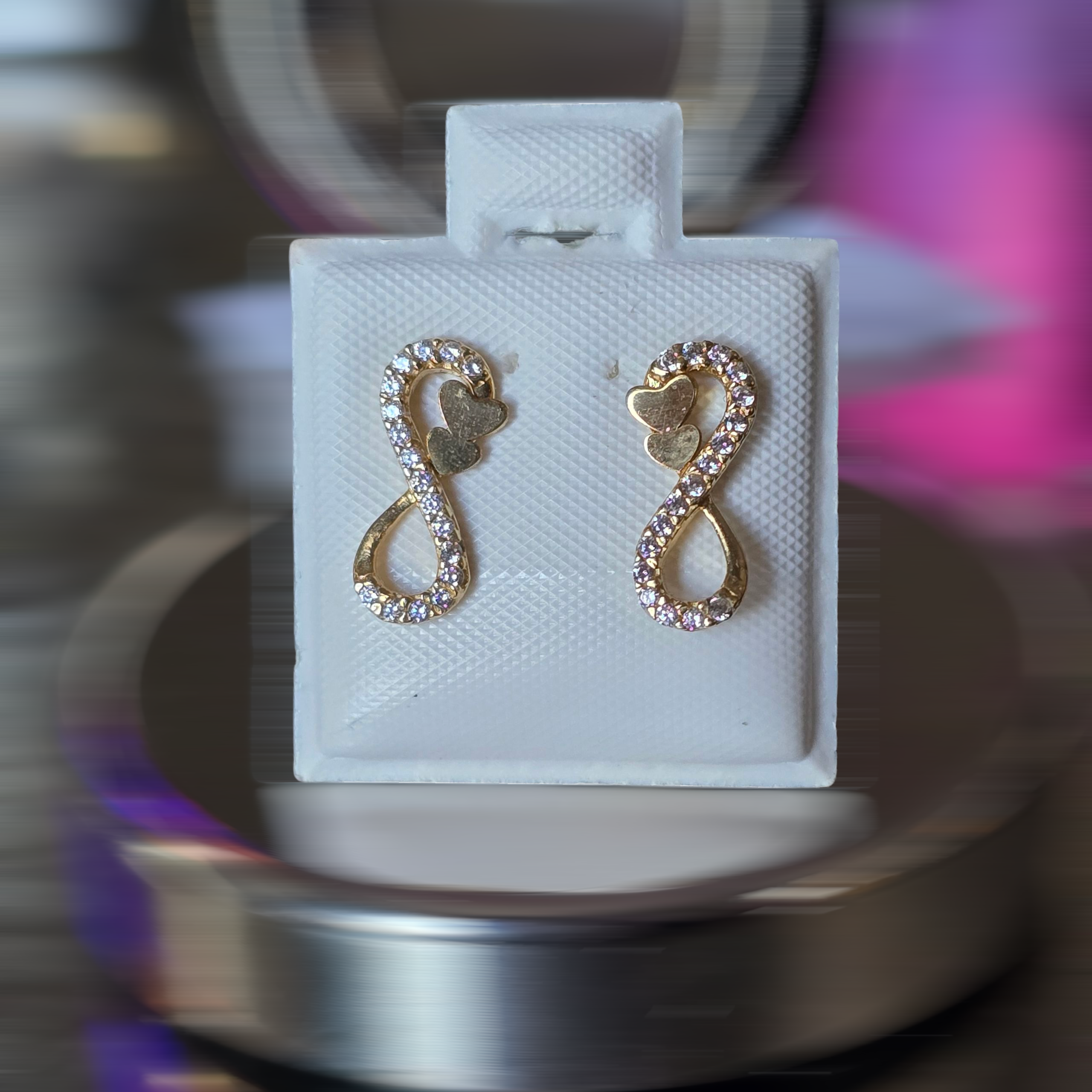 Infinity earrings with butterfly caps, 1.1 grams, in 18-karat Italian yellow gold with white zircons