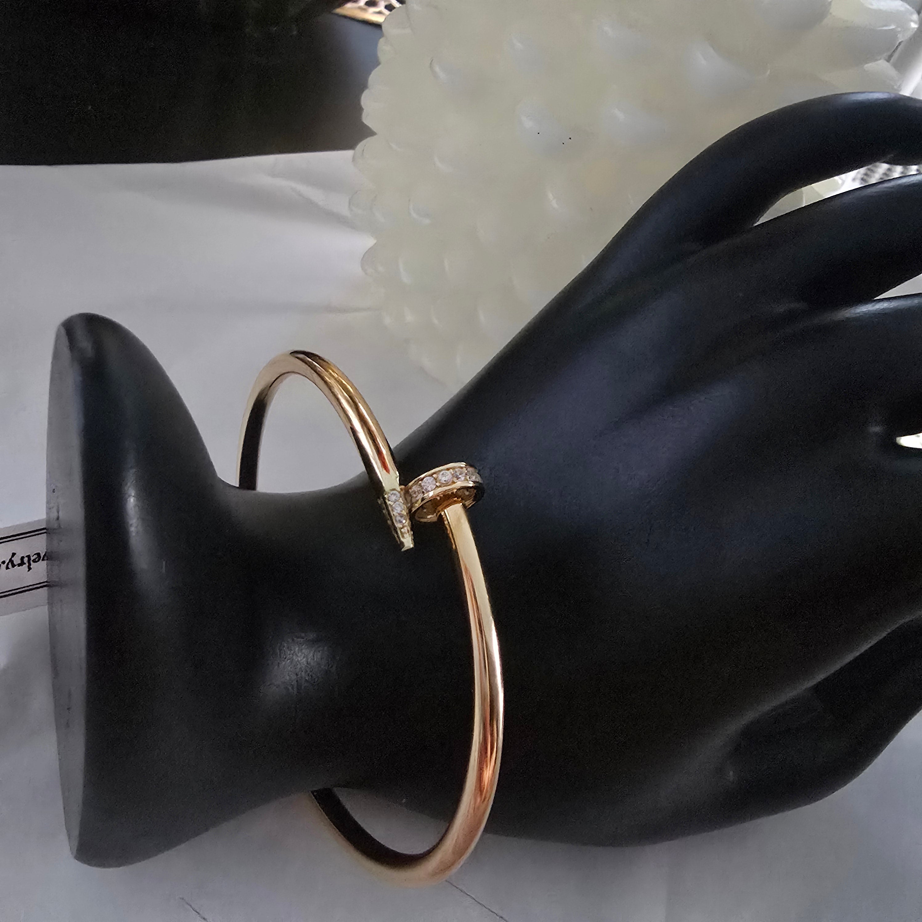 Rigid nail bracelet with spring in 18-karat Italian yellow gold with white zircons, 8.7 grams