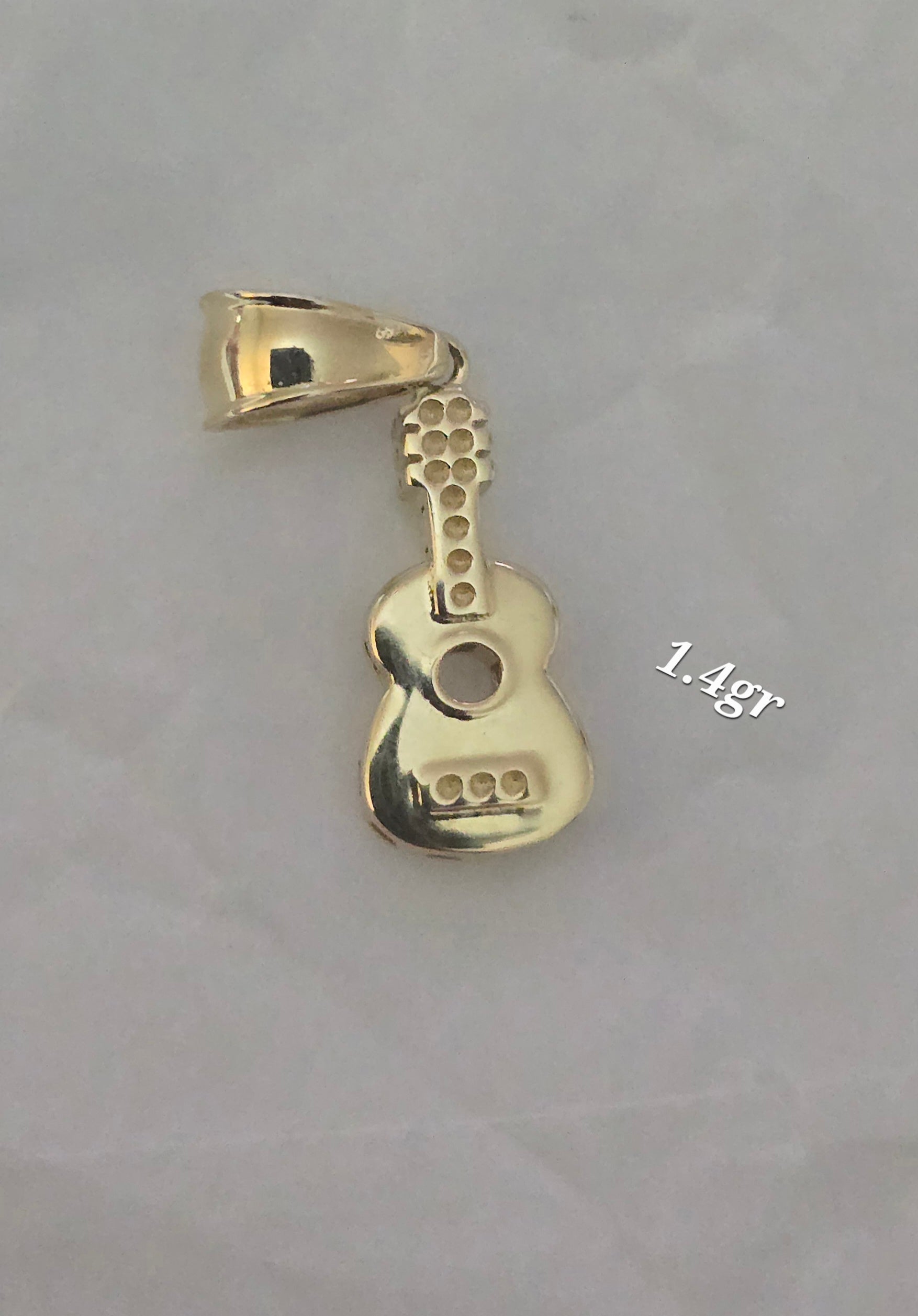 I said guitar weighing 1.4g |