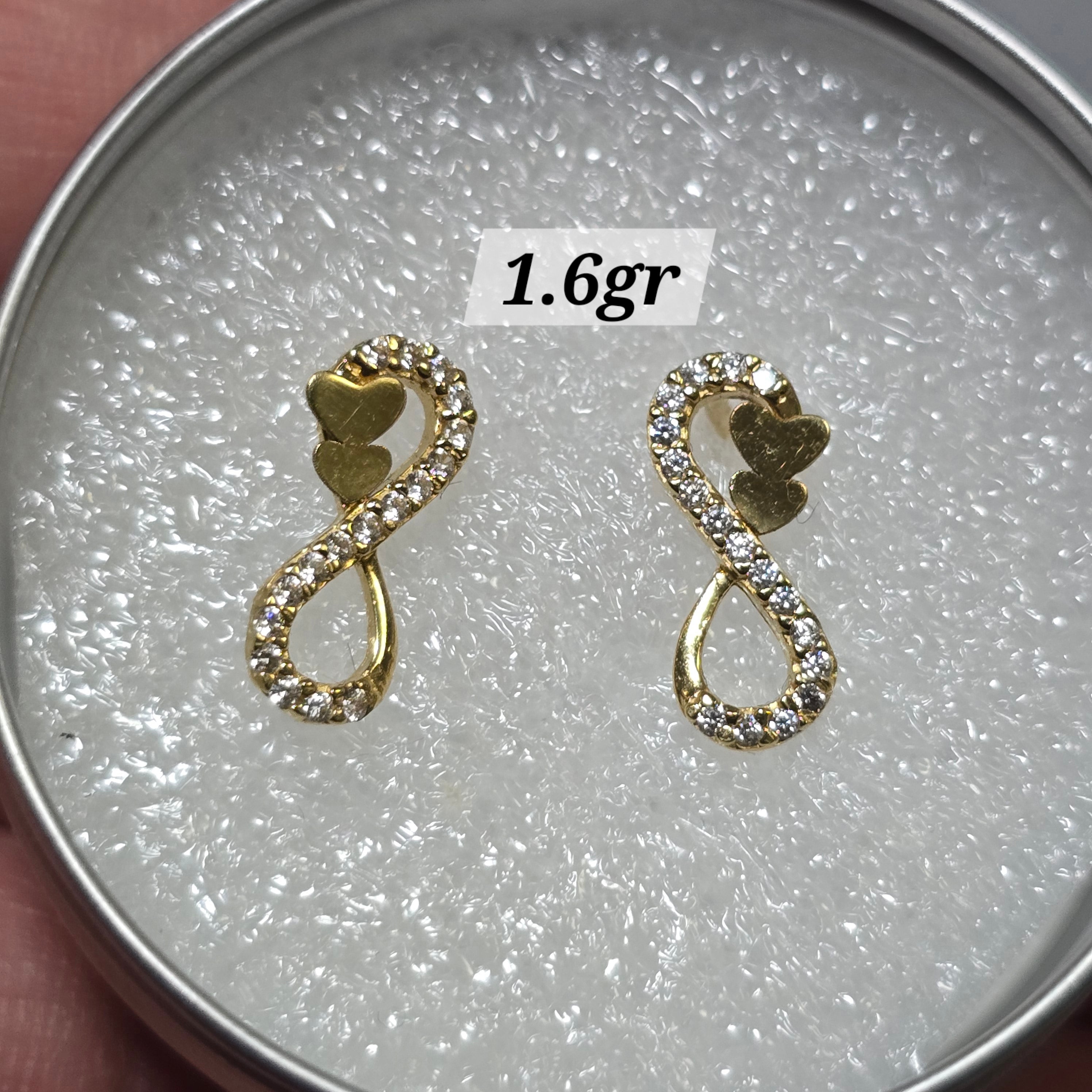 Infinity earrings with butterfly caps and white zircons in 18-karat Italian gold, 1.6