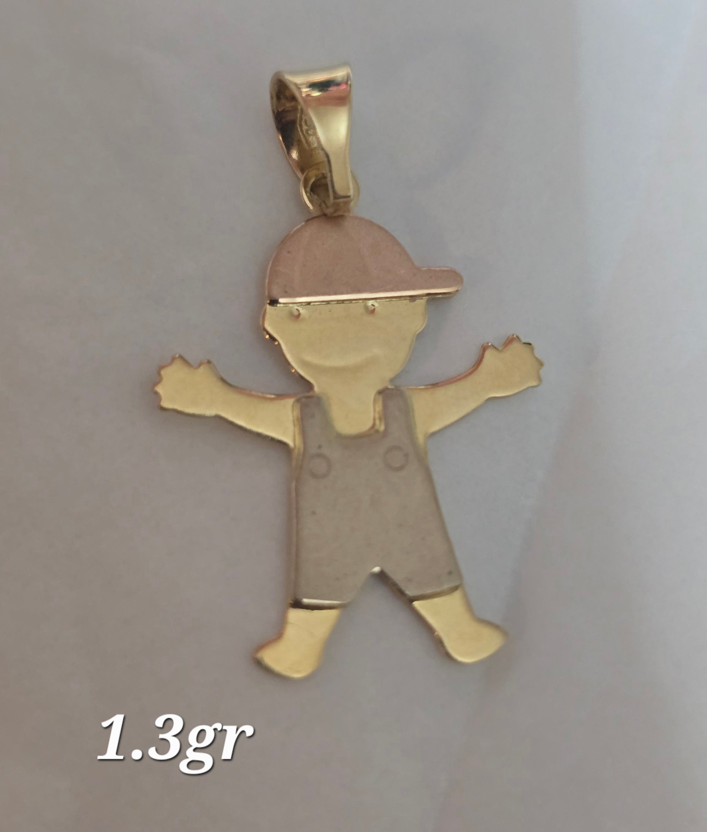 I have a boy pendant in 3 grams of 18-karat Italian gold.