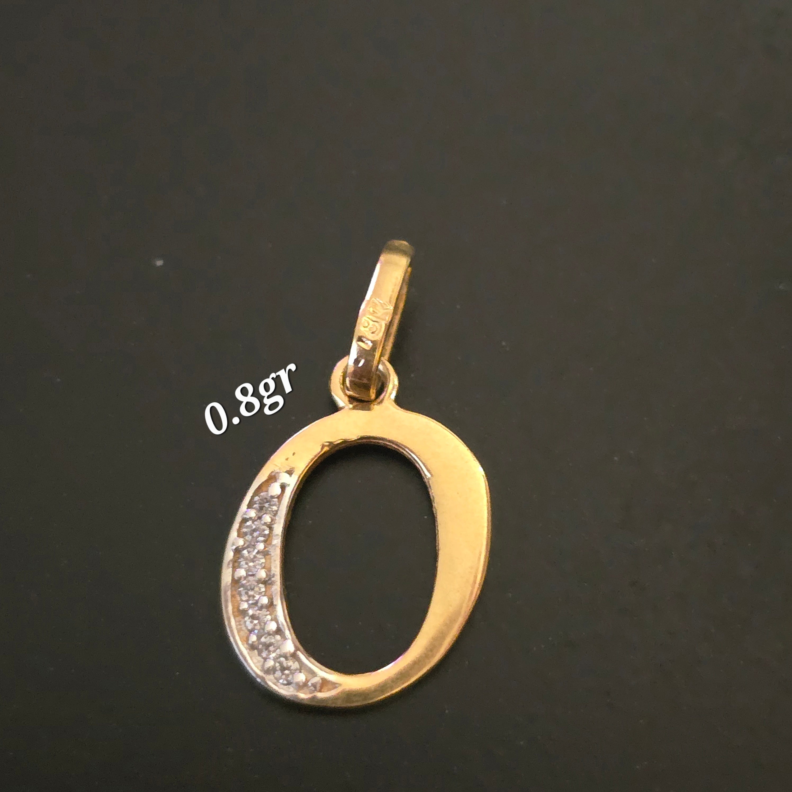 Letter O pendant with white zircons in 18karat Italian yellow gold weighing 0.8 grams