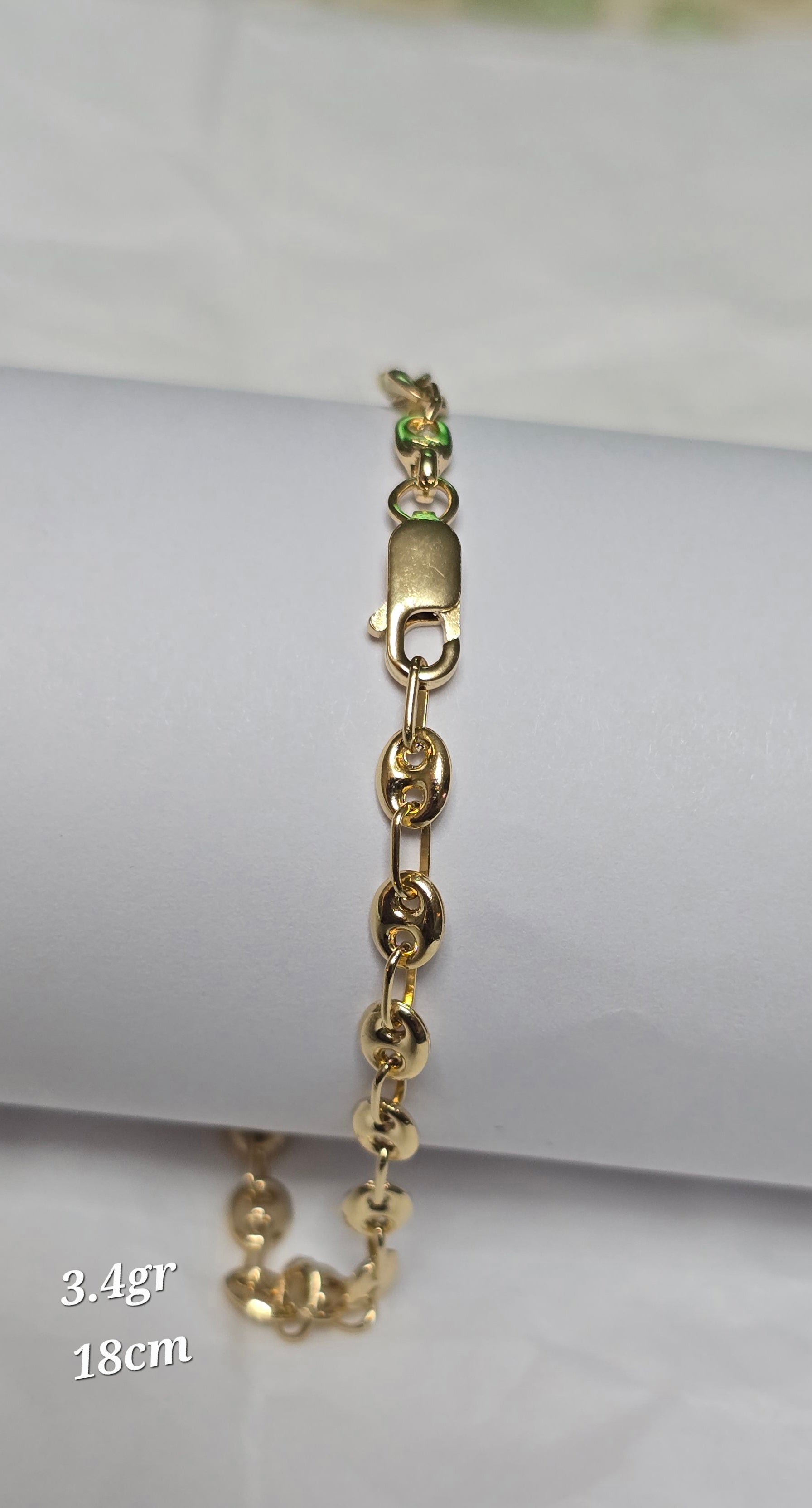Gucci woven bracelet in 18-karat Italian yellow gold, 18 cm long, 3.4 grams