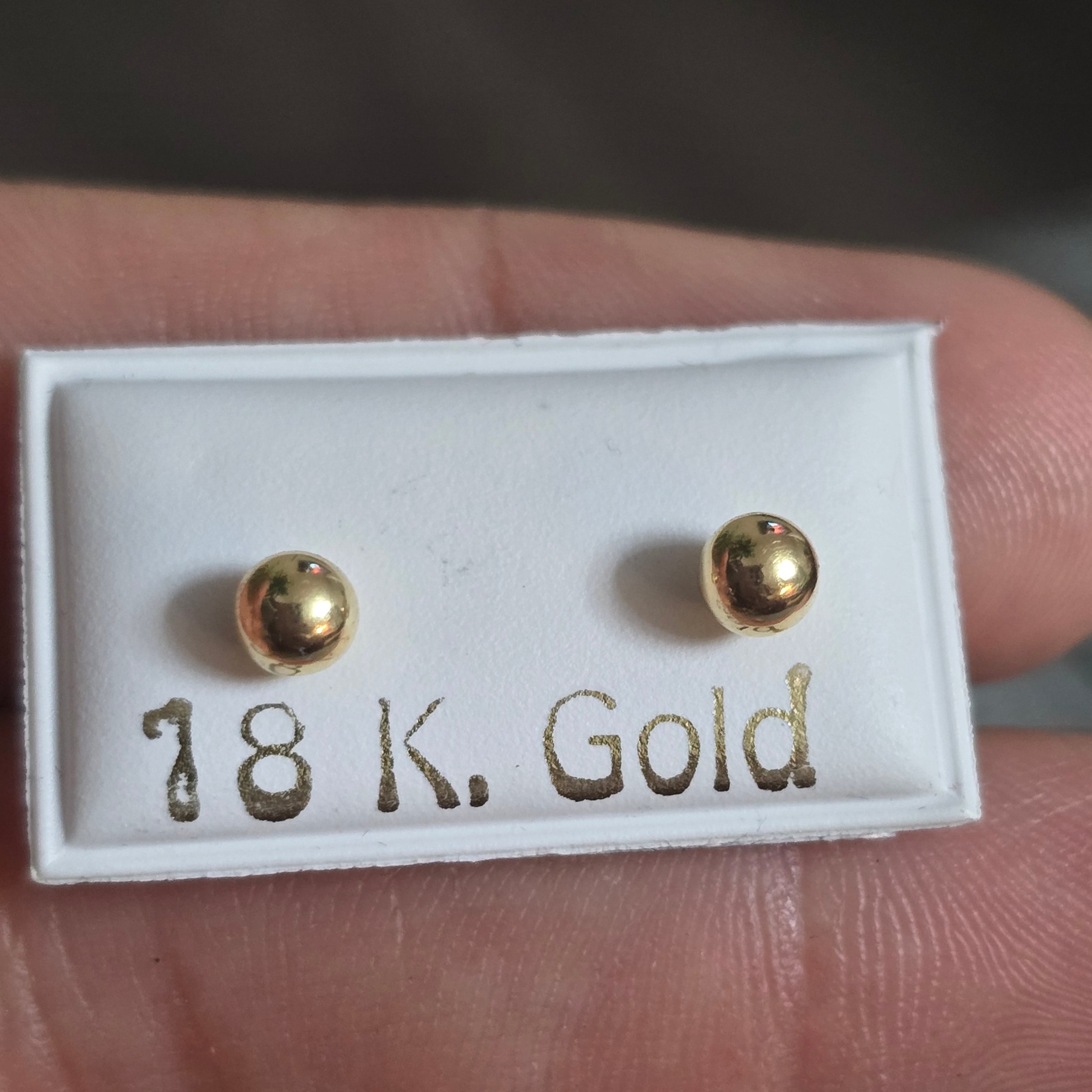 Smooth ball earrings with safety screw-on cap, 0.4 grams, in 18-karat Italian yellow gold